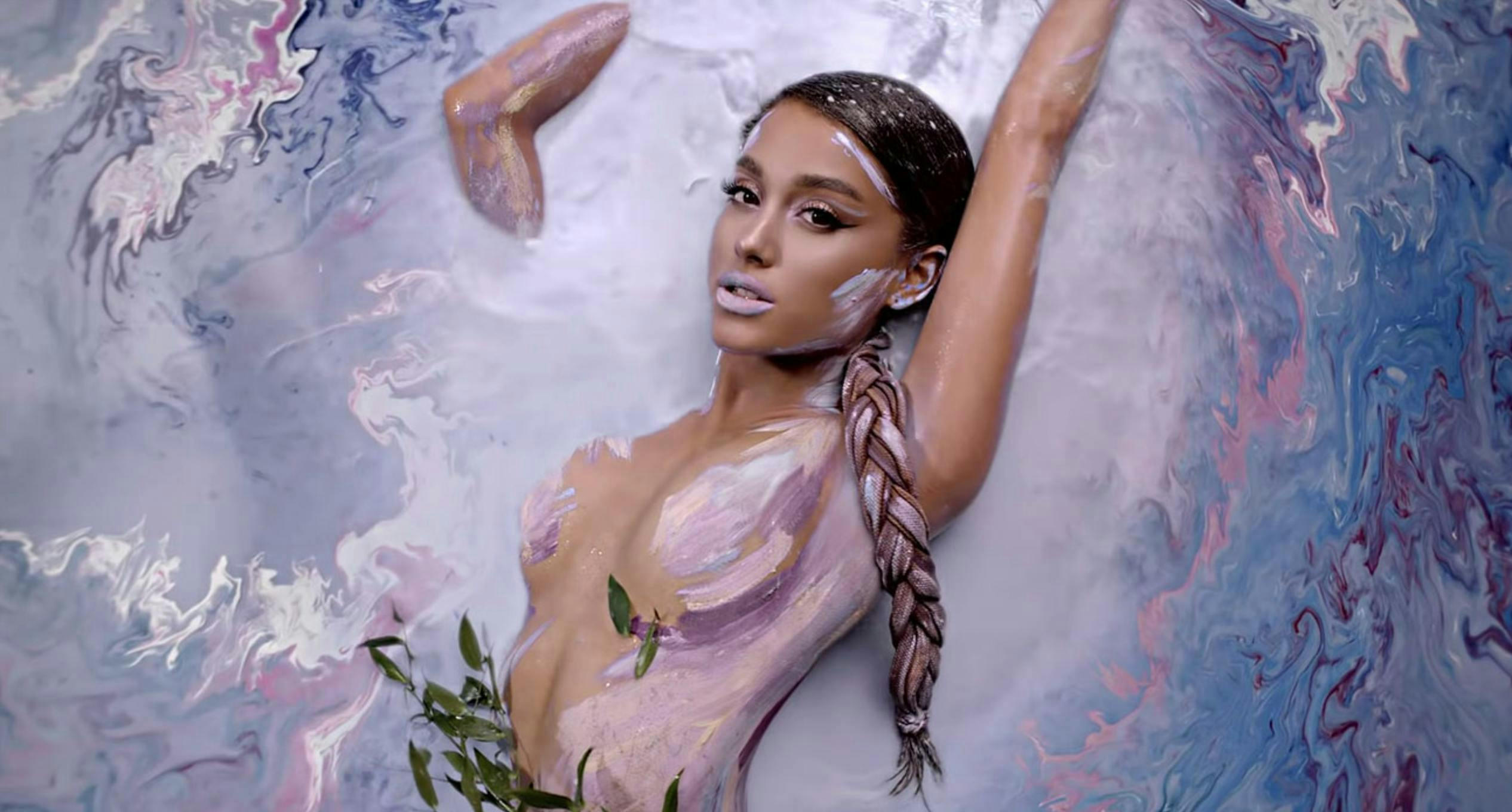 Ariana Grande in pink and blue paint.