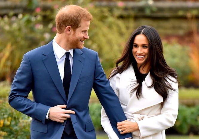 Meghan Markle in white coat and Prince Harry in blue suit
