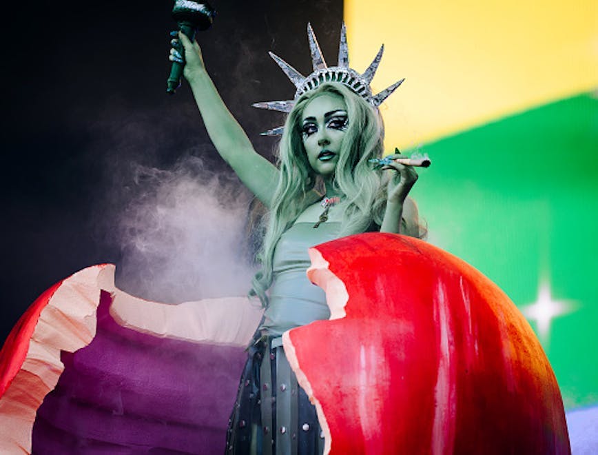 Chappell Roan performing dressed as the Statue of Liberty at the 2024 Governors Ball in NYC.  Getty Images. / chappell roan tour outfits