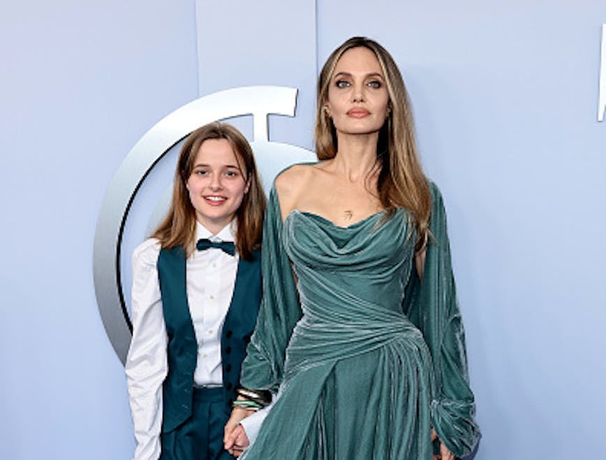 Angelina Jolie in a teal draped gown and her daughter Vivienne in a teal suit and bowtie at the 2024 Tony Awards. Getty Images.