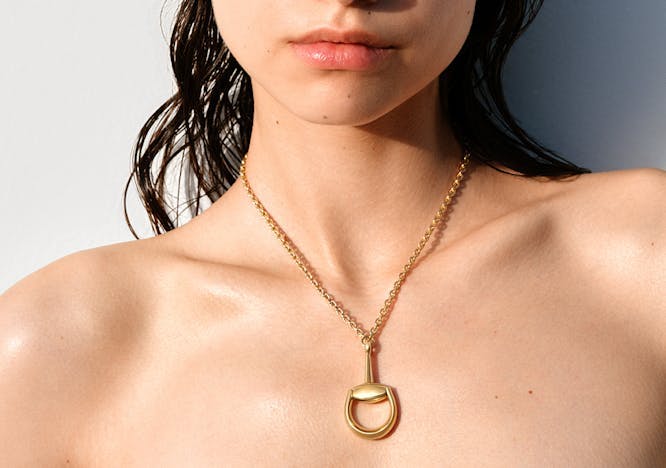 Yellow gold necklace and pendant from the Gucci Horsebit fine jewelry collection. Courtesy of Gucci.