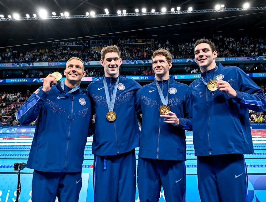 Team USA's 4x100 Men's Relay team showing off their gold medals. Getty.